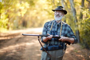 older hunter holding gun - single membership at Royal Stag Preserve