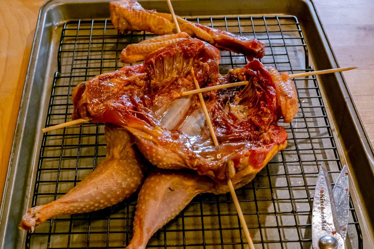 back-of-spatchcocked-pheasant-with-wood-skewers